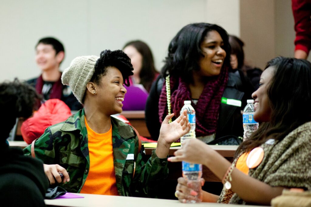 Students laughing together in a classroom